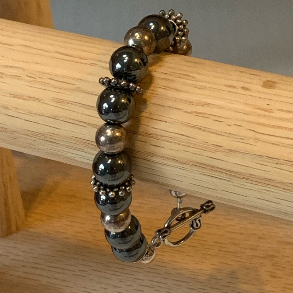 Hematite, and silver bracelet with toggle enclosure
